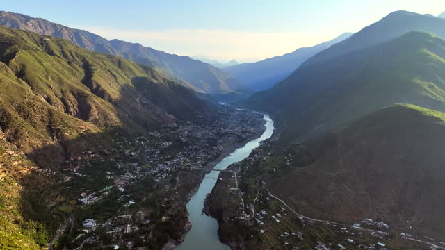 Aerial Drone Sunrise view of Besham city and Rice Field Valley with Indus River in the Shangla District of Khyber Pakhtunkhwa, Pakistan. Located on the right bank of the Indus River in Route of Karakoram Highway