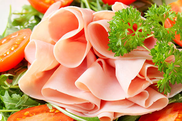istock Sliced ham with arugula leaves and tomatoes 178030152