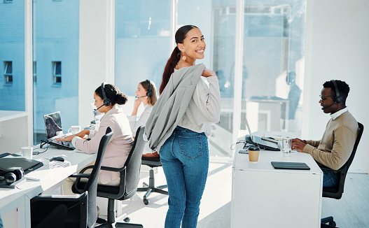Walking, smile and portrait of woman in the office with positive, confident and good attitude. Happy, success and professional female manager checking on call center consultants in modern workplace.
