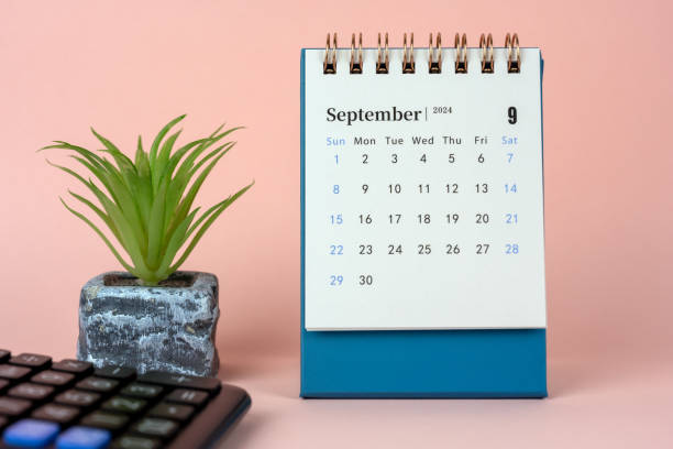 September 2024 Desk Calendar on Blue Background