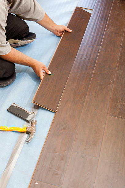 istock Man Installing New Laminate Wood Flooring 178030472