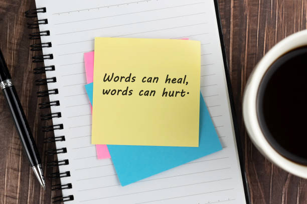 istock Words can heal, words can hurt inspirational quotes on adhesive note 1780305670