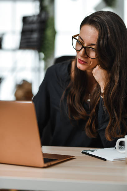 istock Deep Concentration By Female Journalist Working In Office 1780305715