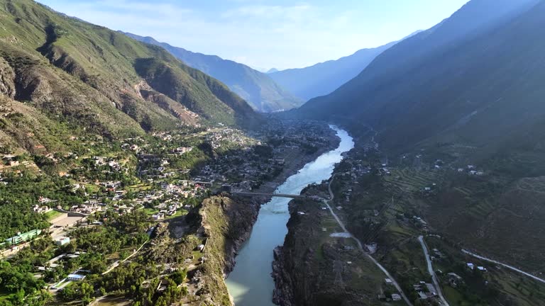 Aerial Drone Sunrise view of Besham city and Rice Field Valley with Indus River in the Shangla District of Khyber Pakhtunkhwa, Pakistan. Located on the right bank of the Indus River in Route of Karakoram Highway