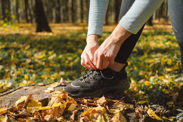 istock The girl ties her shoelaces. 1780306788