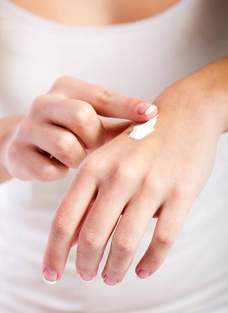 istock Body care. Woman applying cream on hands 178031270