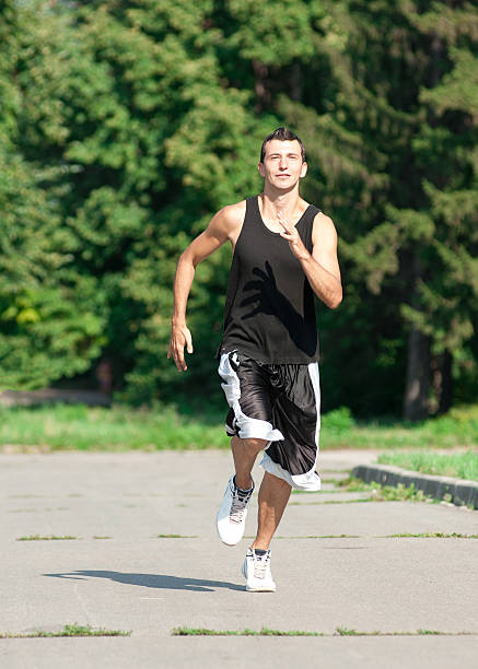 istock Young man jogging in park 178031662