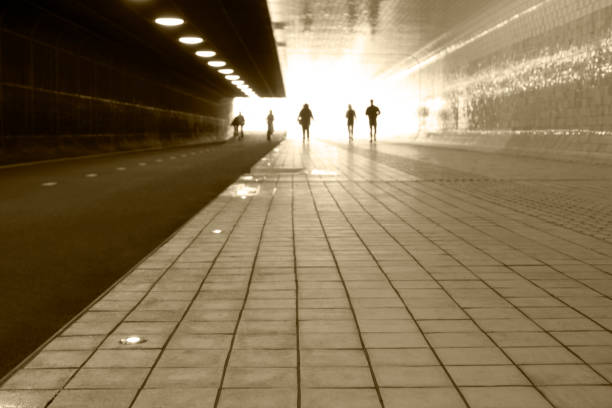 Netherlands. Silhouettes of people in the tunnel under Amsterdam Central Station
