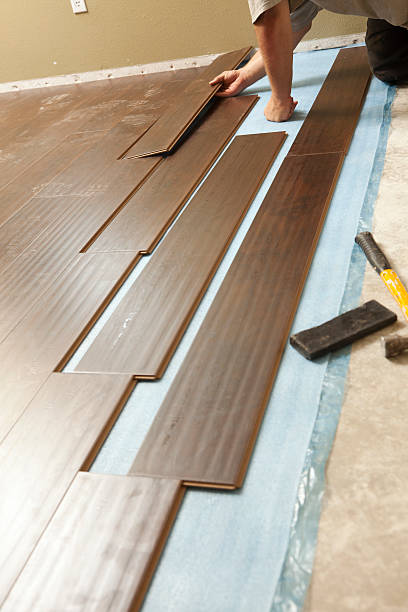 istock Man Installing New Laminate Wood Flooring 178032334