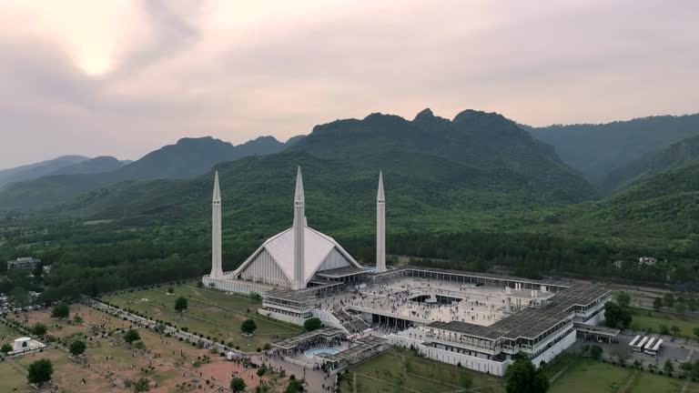 Aerial Drone Sunset Scene of Shah Faisal Mosque is one of the largest Mosques in the World which is situated in Islamabad, Pakistan.