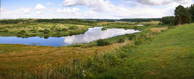 Horizontal panorama of the view of the village of Mikhailovskoye and the Sorot river.