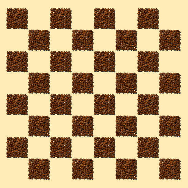 Square pattern of coffee beans poured in the form of squares. Squares from coffee grains on light yellow background in the form of a chessboard .