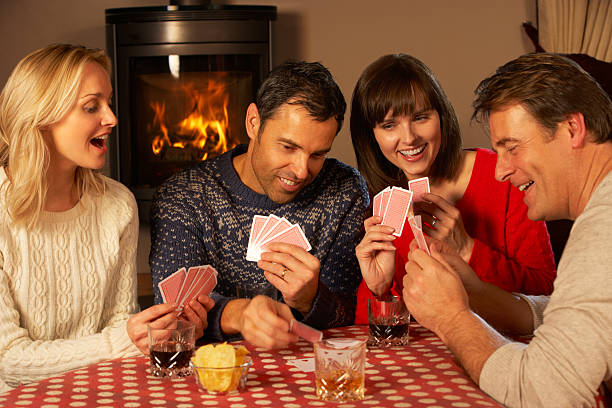 istock Group Of Middle Aged Couples Playing Cards Together 178033204