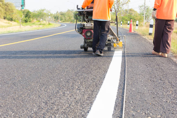 istock Machine eject and worker on road and traffic sign painting 1780334800