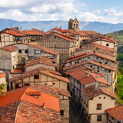 Stone houses with their Moorish tile roofs and their Romanesque church in the medieval village of Frias, Castile