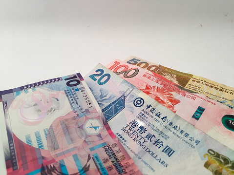 Several Hongkong dollar banknotes on a white background