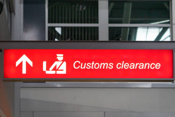 istock Customs sign in Airport and direction arrow, red and lighted. 1780338540