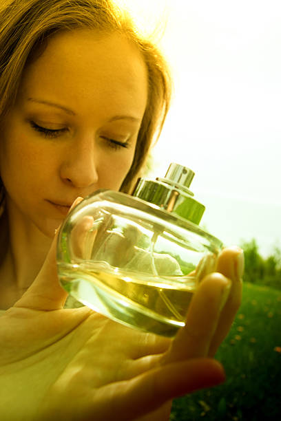 istock Woman with bottle of perfume 178033908