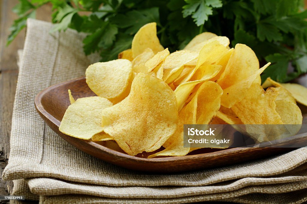 potato chips in wooden plate Crunchy Stock Photo
