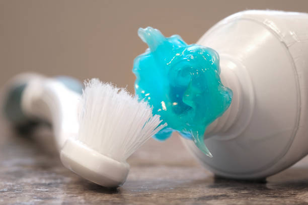 istock Worn Toothbrush and Messy Toothpaste Blue Gel for Brushing Teeth 1780340409