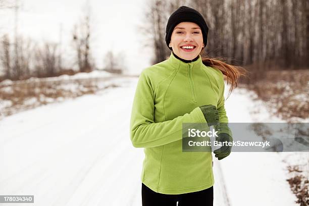 Woman Running In Winter Stock Photo - Download Image Now - Jogging, Winter, Running