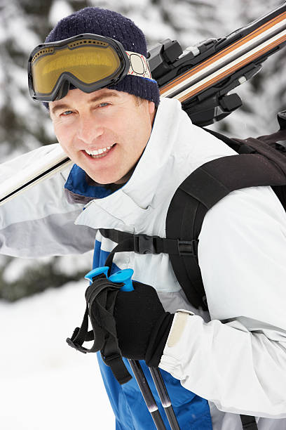istock Middle Aged Man On Ski Holiday In Mountains 178034600