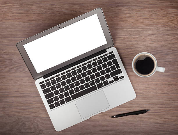 istock Laptop and coffee cup on wood table 178034608
