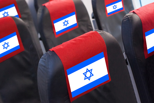 Empty seat in plane with Israeli Flag. Travel, flight and transportration in Israel concept