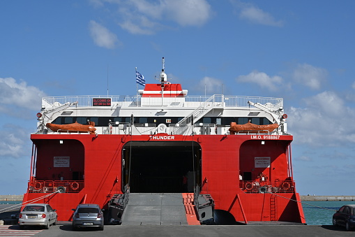 Heraklion, Greece 09 13 2023, Opened stern ramp and doors of Festos Palace, cruise ferry with red and white hull. Vessel is flagship of the Minoan Lines and is moored in port of Heraklion in Crete.