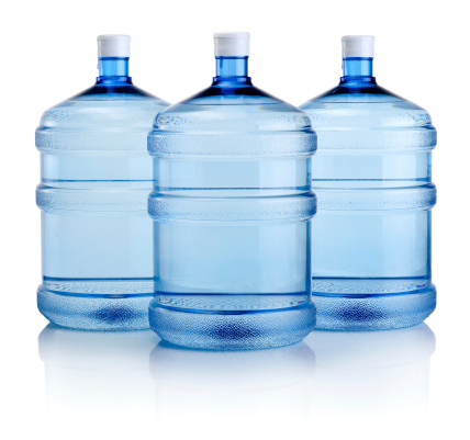 Tres botellas de agua grande aislado sobre un fondo blanco photo