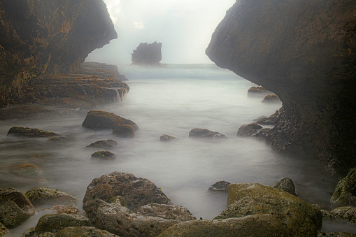 A sunrise image between the coral rocks at Bathsheba on the east coast of Barbados