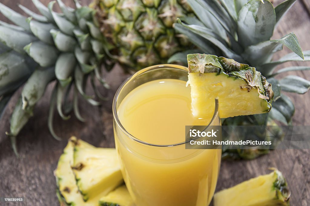 Fresh made Pineapple Juice Fresh made Pineapple Juice with fresh pieces of pineapples Pineapple Juice Stock Photo