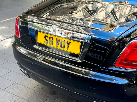 London, England, UK - 23 August 2023: Close up view of the personalised number plate on a Rolls Royce car owned by The Savoy Hotel.