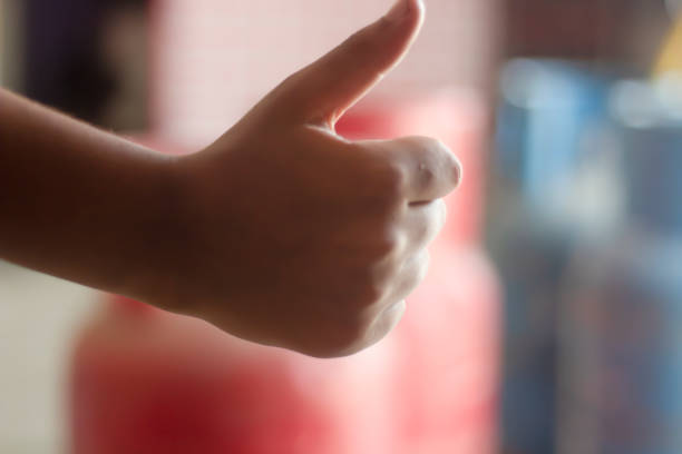 istock A man pointing his thumb up and blurred background 1780367997
