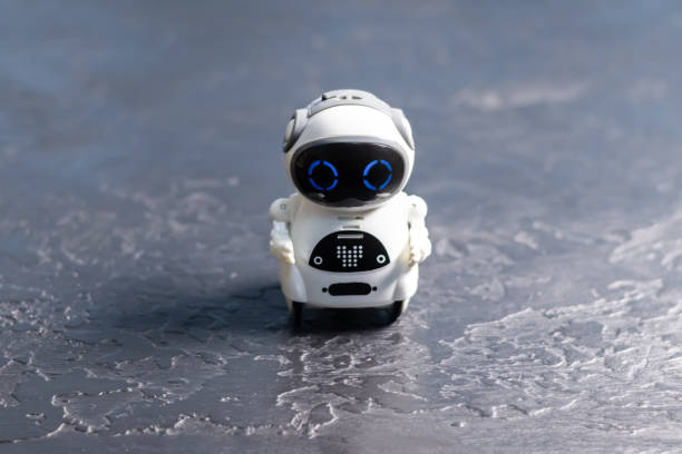 istock Real white small Robot on black table. Futuristic future technology. Business helper for development. 1780370234