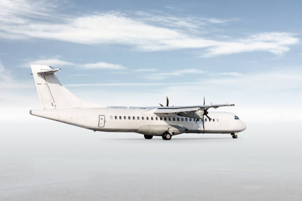 istock White passenger turboprop airplane isolated on bright background with sky 1780371125