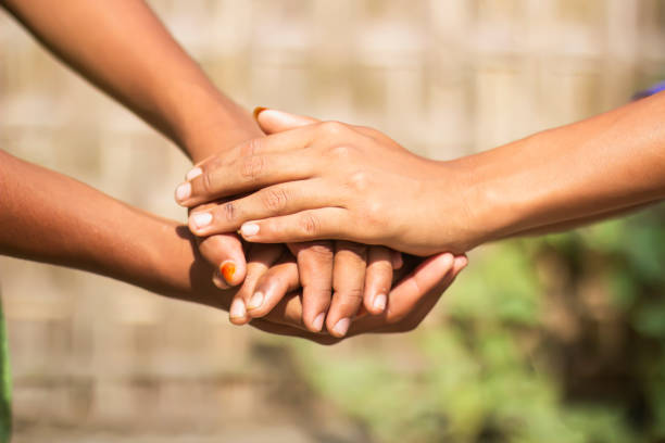 istock Many people have hands together and blurred background 1780371429
