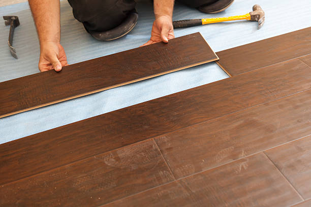 istock Man Installing New Laminate Wood Flooring 178037390