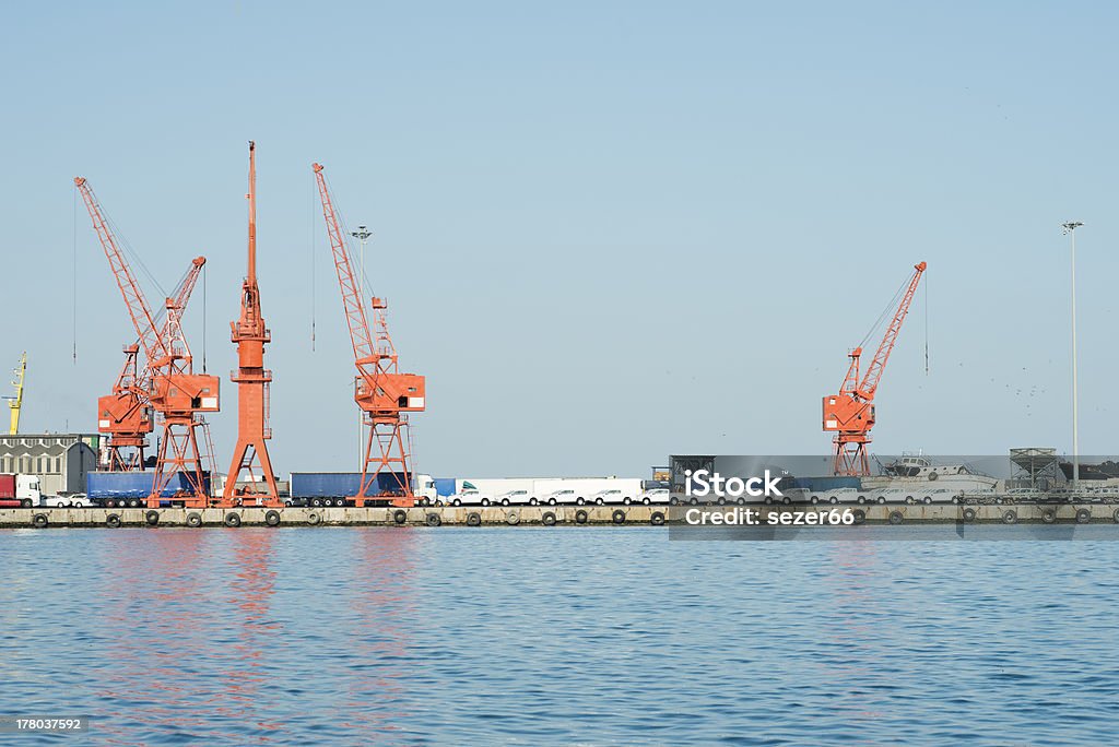 Harbor cranes in the port Large harbor cranes, Harbor cranes in the port Blue Stock Photo