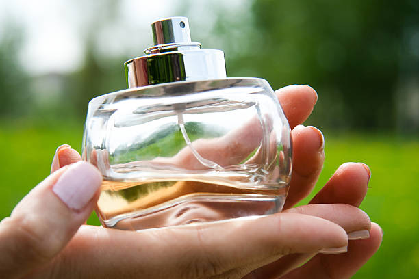 istock Woman with bottle of perfume 178037911