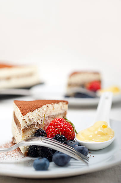 istock tiramisu dessert with berries and cream 178038057