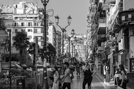 View of a back street of Valencia with the restaurants and bars. Taken in black and white at dusk. Taken in July 2018