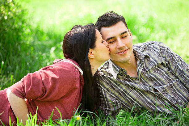 istock Couple Relaxing on Green Grass.Park. 178039248