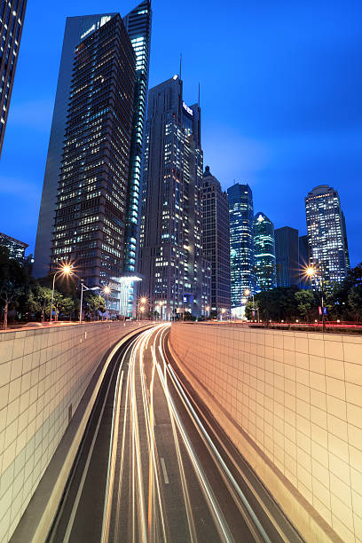 istock tunnel and modern building in shanghai at night 178041098