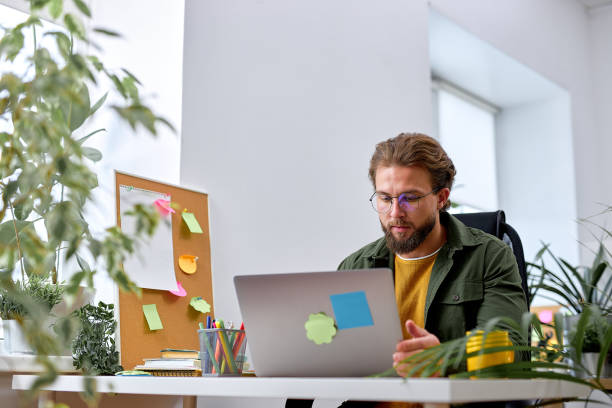 istock Analyzing data on laptop. concentrated bearded man in casual wear sit with laptop 1780412113