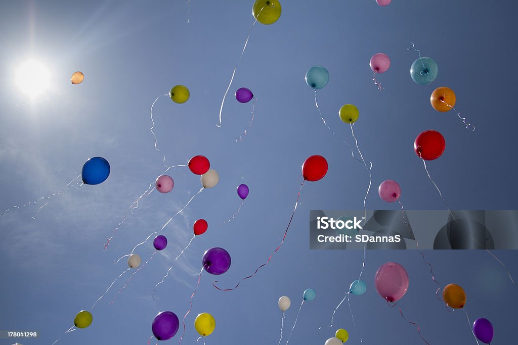 flying balloons Released flying huge balloons and  blue sky Balloon Stock Photo
