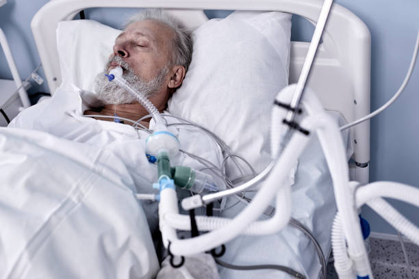 istock Sick Senior Patient Rests on Bed, Man Sleeping in Modern Hospital Ward. 1780415548