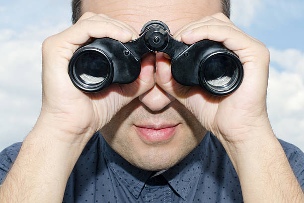 istock Portrait of a Voyeur with Binoculars. 178041638