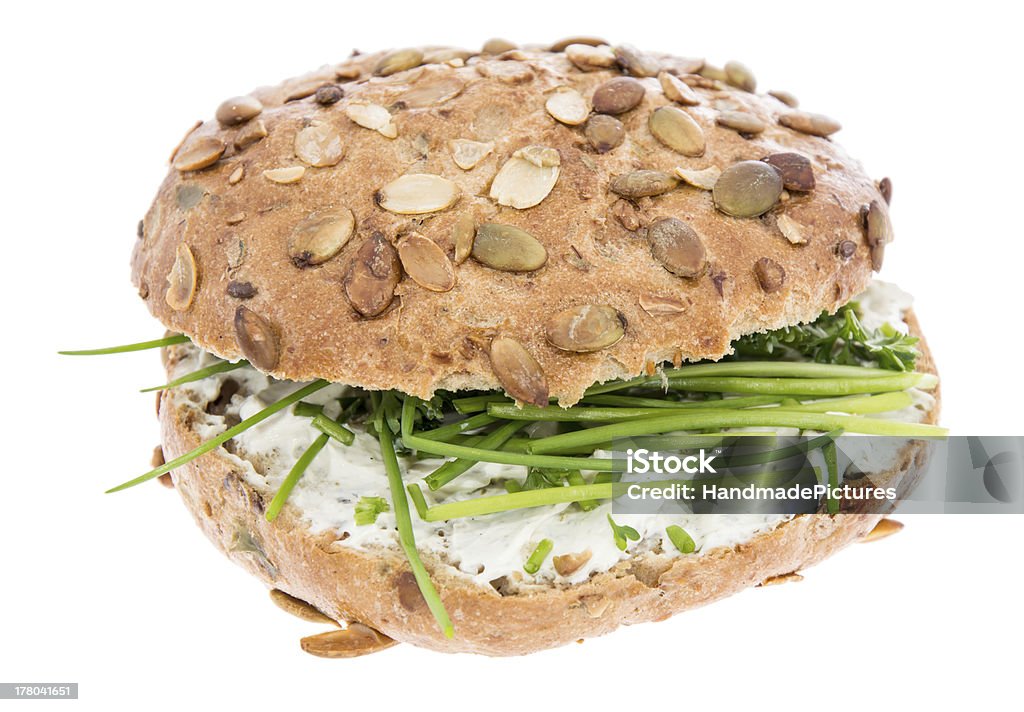 Cream Cheese on a roll with herbs Cream Cheese on a roll with fresh herbs isolated on white Appetizer Stock Photo