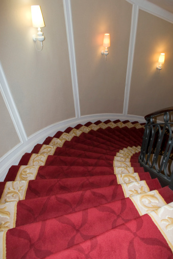 Staircase covered with red carpet
